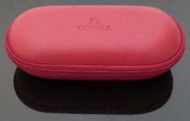 Omega travelling watch case together with three Omega Seamaster watch links and an Omega watch