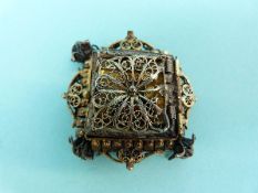 A white metal filigree pendant set with an Indian miniature, a white metal filigree icon,