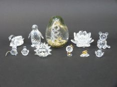Ten Swarovski cut glass animals and objects including a large penguin, bears,