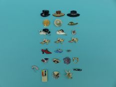 A collection of brooches in the form of hats and shoes including plastic and gem set