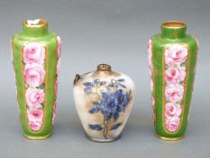 A pair of Royal Doulton faience vases (19cm tall) and one other