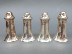 Two pairs of George V hallmarked silver peppers, Sheffield 1913 and 1922, maker Atkin Brothers,