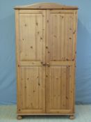 A two door pine wardrobe (W95 x D52 x H182cm)
