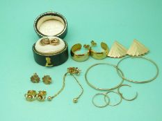 A pair of 9ct gold knot earrings, three pairs of 9ct gold hoop earrings,