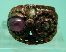 A Georgian ring set with a ruby cabochon and rose cut diamonds