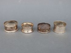 Four various hallmarked silver napkin rings,