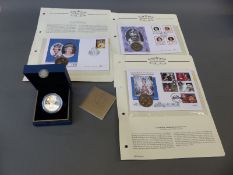 A cased gilt Royal Mint commemorative crown 2012 together with a further three examples with stamp