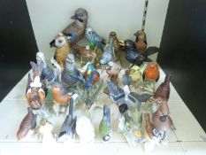 A collection of approximately 27 Goebel birds
