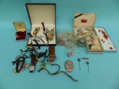 A collection of costume jewellery including watches, faux pearls,