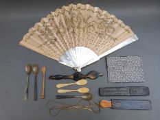 A collection of bone, horn and similar items including a fan,