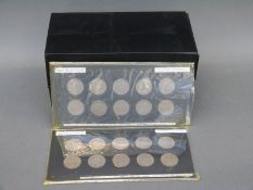 An amateur collection of English shillings 1948-1951, mounted in cards,