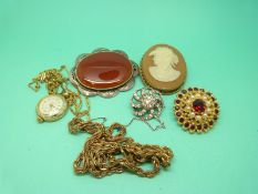 A silver and paste brooch, a silver brooch set with agate,
