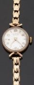 Vertex Revue 9ct gold ladies wristwatch with gold hands and Arabic numerals and silvered face,