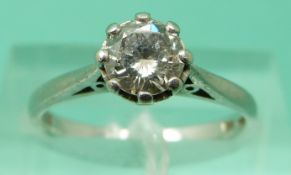 A platinum ring set with round cut solitaire diamond of approximately 0.