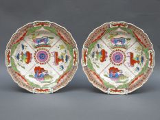 A pair of Worcester first period gadrooned plates hand decorated in the Dragons in Compartments