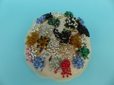 A collection of beaded brooches