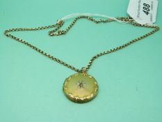 A 9ct gold chain with a yellow metal locket marked 9ct back and front set with a diamond