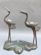 A bronzed study of two cranes,