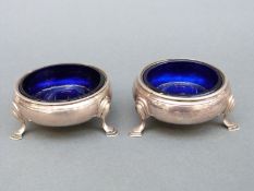 A pair of George II three-footed hallmarked silver open salts, London 1745,