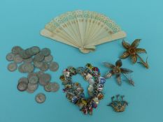 Silver and enamel charm bracelet, filigree brooches, fan,