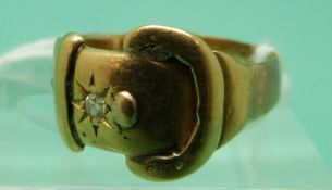 An 18ct gold buckle ring set with two diamonds, 3.