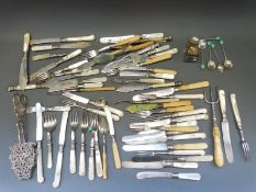 A large collection of silver plated cutlery mostly with mother of pearl and ivory handles