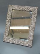 A Victorian hallmarked silver framed dressing table mirror with easel back, Ldn 1897,