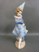 A Lladro figure of a clown with trumpet