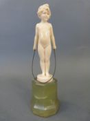 Ferdinand Preiss carved ivory figure of a girl with a skipping rope, signed to plinth below feet,
