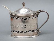 A Scottish George V hallmarked silver mustard with blue glass liner, Edinburgh 1925,