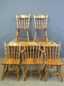 A pine table (L141 x W80cm) and five chairs including one carver