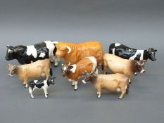 Eight Beswick cattle including Friesian family, Jersey,