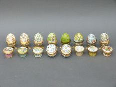 A quantity of Halcyon Days and other enamel pill boxes and eggs