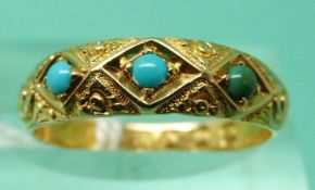 An 18ct gold ring set with three turquoise cabochons, London 1875 (size M),