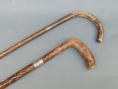 Two hallmarked silver-collared walking sticks
