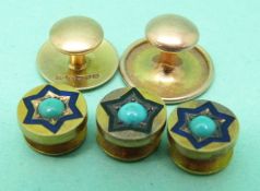 Two 15ct gold studs and three yellow metal studs each set with a turquoise cabochon
