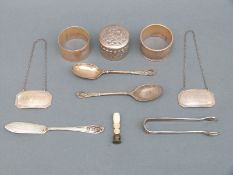 A pair of claret and brandy hallmarked silver bottle tickets or labels, Sheffield 1935 and 1936,