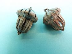 Eight pairs of white metal filigree earrings including flowers, spheres,