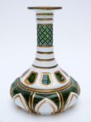 Overlaid glass vase with white casing over green ground highlighter in gilt,