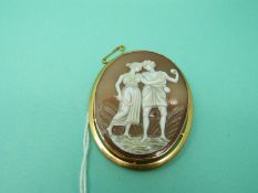 A 9ct gold brooch set with a cameo depicting a courting couple