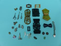 Two small silver button hooks, silver bracelet, silver charms, mother of pearl charms,