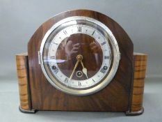 A c1930 three train English mantel clock with Roman chapter ring on utility dial,