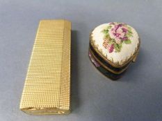 A Must de Cartier gold plated lighter and a cloisonne enamel heart shaped pin cushion