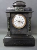 A late 19thC black slate mantel clock with green marbled decoration & enamel Roman dial,