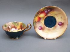 Royal Worcester painted fruit cup and saucer with speckled teal ground,