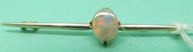 A 15ct gold brooch set with an opal cabochon