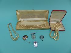 A cultured pearl necklace,