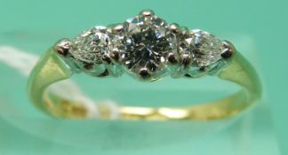 An 18ct gold ring set with a modern round brilliant cut diamond measuring approximately 0.