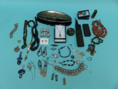 A silver curb link bracelet, a silver ring in the form of a snake, two silver necklaces,