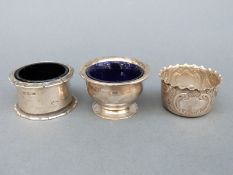 Three various hallmarked silver salts two with blue glass liners,